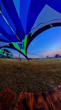 Music festival view under a blue canopy tent