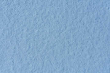 Texture of the white fluffy snow for background