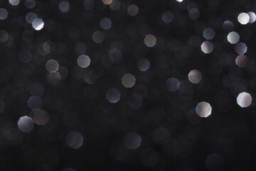 Glitter vintage lights background, light silver and black