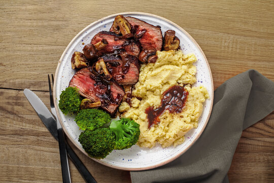 Juicy Beef Steak with Mushroom Sauce and Potato Mash