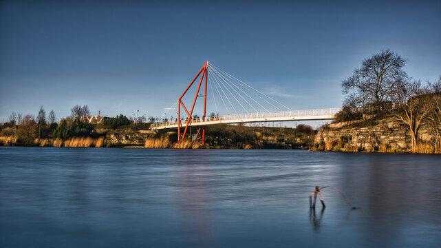 Red Suspension Pedestrian Bridge Over Pae Lake Long Exposure - Powered by Adobe