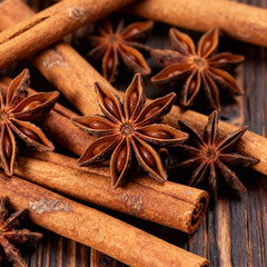 Cinnamon Sticks and Star Anise Spices Macro Texture on Rustic Wood