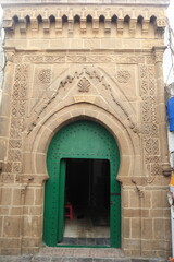 Traditional Moroccan Wooden Door with Archway
