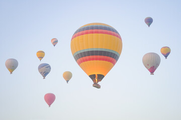 Hot Air Balloons over Cappadocia Valleys in Nevsehir, Turkiye
