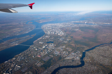 view from the window of an airplane to the city of Arkhangelsk and the Severnaya Dvina River