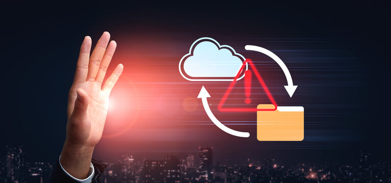 A hand is raised in a stopping gesture, symbolizing the prevention of cybersecurity threats associated with cloud data and digital file management. Gantry