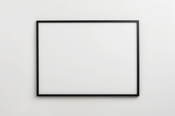 empty black picture frame hanging on bright white wall minimal gallery setting clean modern mockup with generous copyspace concept of interior design branding