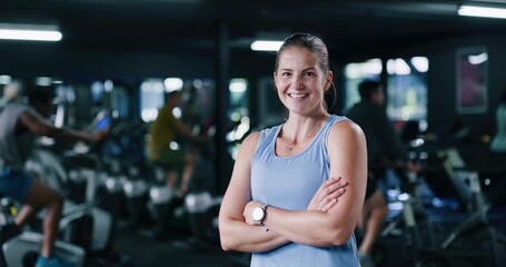 Face, fitness and happy woman in gym with arms crossed, confidence and spin class instructor. Portrait, smile and indoor cycling coach in health club for exercise, professional trainer and pride - Powered by Adobe