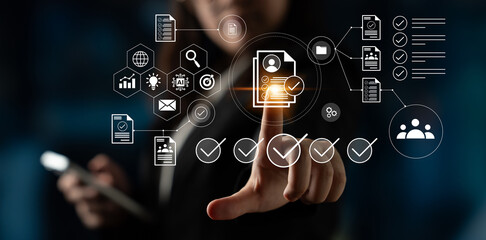 Business professional engages with a digital interface showcasing icons and data elements, symbolizing innovation, compliance, and effective data management in a modern workplace. Gantry