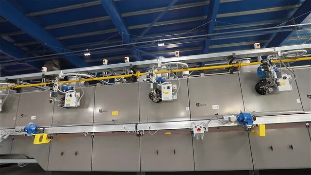 Roller Kiln for the Production of Ceramic Tiles. Firing. The roller kilns. Close-up. Industrial drying for ceramics. Industrial kilns for Ceramic Tiles. Manufacturing process of ceramic tiles. 