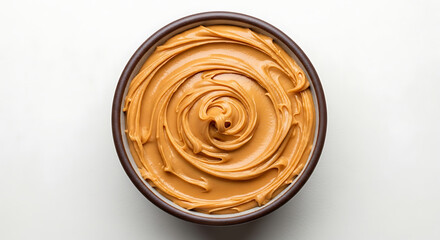 Creamy peanut butter swirls in an oval dish
