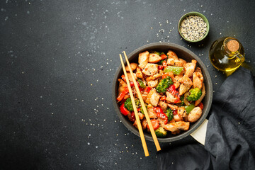 Chicken stir fry with vegetables and sesame.