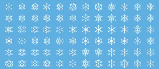 Magical winter snowfall background with delicate snowflakes against a soft blue sky, perfect for festive holiday designs and seasonal promotions