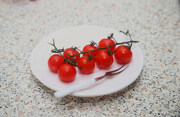 cherry tomatoes on a white plate