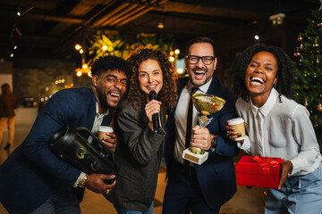 Diverse business colleagues celebrating successful team building with karaoke
