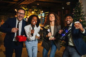 Diverse colleagues celebrating success and achievement at office party