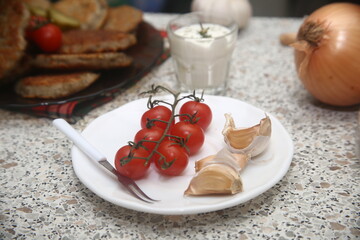 red tomatoes on a plate