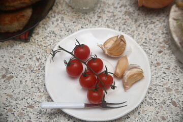 red cherry tomatoes on a plate