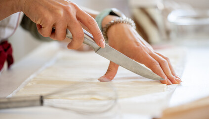 Woman Cutting Dough For Cookies