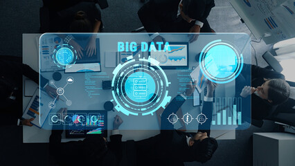 A modern business meeting showcasing a big data analytics interface, digital displays, and team collaboration in a contemporary office environment. Trope