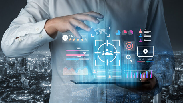 A business professional engages with a digital analytics interface displaying diverse metrics and insights, showcasing technology impact on modern life. Gantry - Powered by Adobe