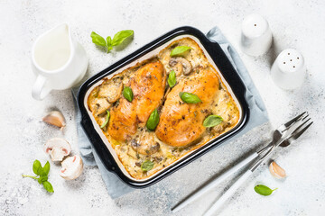 Baked chicken breast with mushrooms in cream sauce.