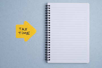 Tax time reminder on calendar and notepad highlighting financial deadline