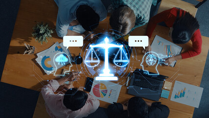 A diverse team engages in a collaborative discussion over legal matters, highlighted by a digital balance scale symbolizing justice in a modern office setting. Trope
