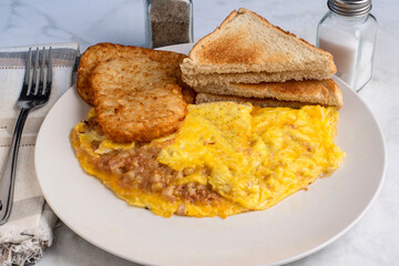 corn beef hash omelette with hash browns
