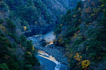 Autumn Dream Suspension Bridge over Emerald Lake in Sumatakyo, Japan