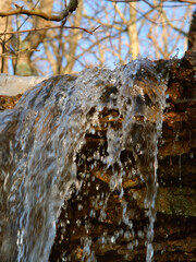 Small waterfall of melting snow at Kickapoo State Park in Illinois