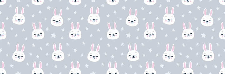 Cute seamless pattern with white bunny faces on a grey background. Adorable hand-drawn rabbits with pink cheeks, surrounded by stars. Perfect for kids textiles, nursery decor and wrapping paper