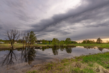 Cloudy sky with a lake in the foreground