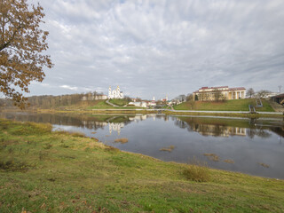 Peaceful scene of a river with a town in the background
