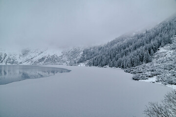 Morskie Oko Lake Covered in Ice at Winter in Tatra Mountains Poland. © ngchiyui