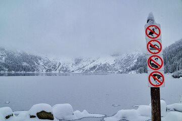 Morskie Oko Lake Covered in Ice at Winter in Tatra Mountains Poland. © ngchiyui