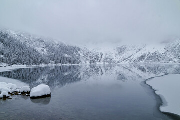 Morskie Oko Lake Covered in Ice at Winter in Tatra Mountains Poland. © ngchiyui