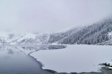 Morskie Oko Lake Covered in Ice at Winter in Tatra Mountains Poland. © ngchiyui