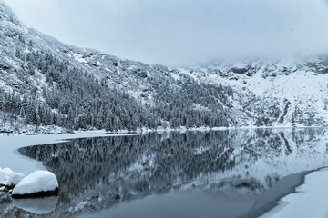 Morskie Oko Lake Covered in Ice at Winter in Tatra Mountains Poland. © ngchiyui