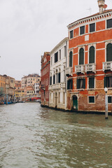 Fototapeta premium Venice canal with historical buildings and arched bridge