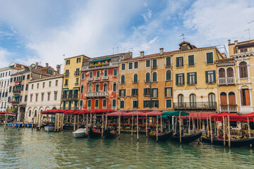 Venice Grand Canal with moored gondolas and historic buildings