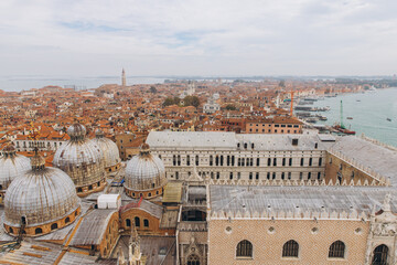 Venice cityscape with St. Mark's Basilica domes and Doge's Palace