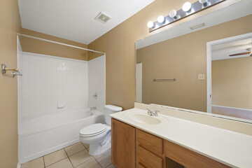A wellequipped bathroom featuring a toilet, sink, and a bathtub