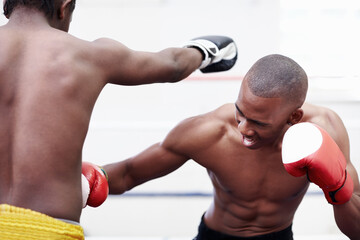 Sport, black men and boxing for fight, punch or practice with challenge in ring. Boxer, people and match for training with fitness competition, combat or workout with exercise for attack in gym