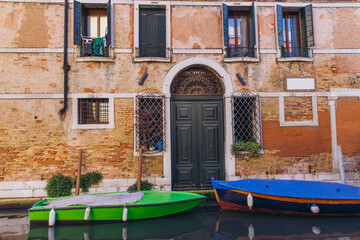 Colorful boats floating in Venice canal