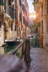Venice canal with boats and historic buildings