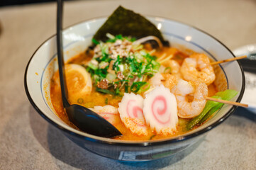 Japanese ramen soup with shrimps, egg, chives and sprout