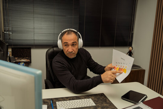 Businessman showing business plan during remote meeting