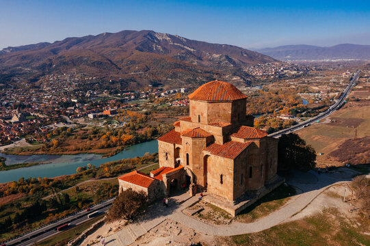 Drone aerial view of Jvari monastery and the mountains in Mtskheta, Georgia