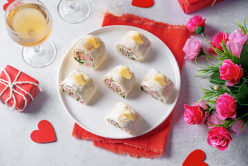 Cream cheese dill ham pinwheel on a plate for Valentine's day holidays